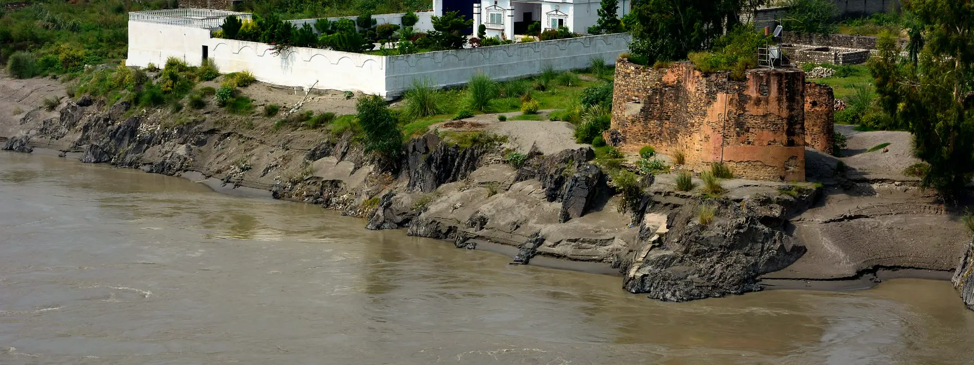 Aerial view of the old fort and green banks along the Indus River at Attock