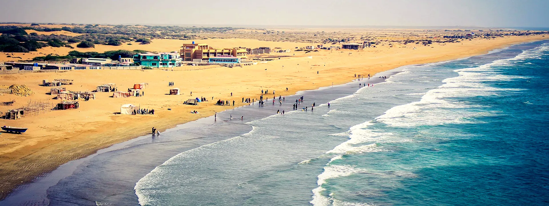 Aerial view of the golden sands and blue sea at Kund Malir Beach on the Balochistan coast