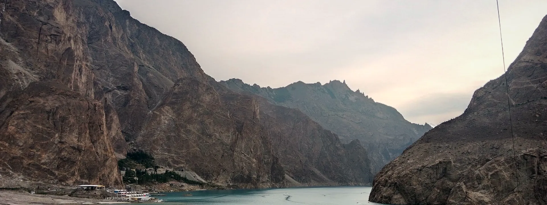 The turquoise water of Attabad Lake surrounded by mountains in Hunza