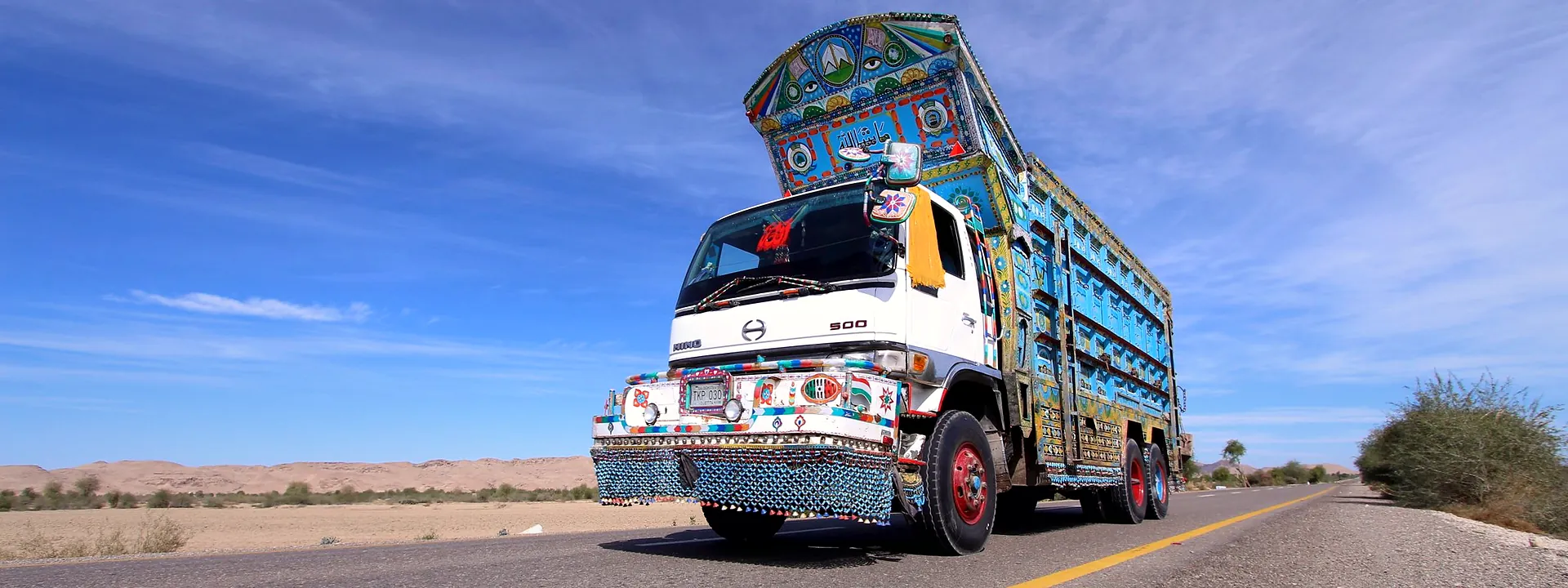 A brightly decorated truck on the highway through Khuzdar