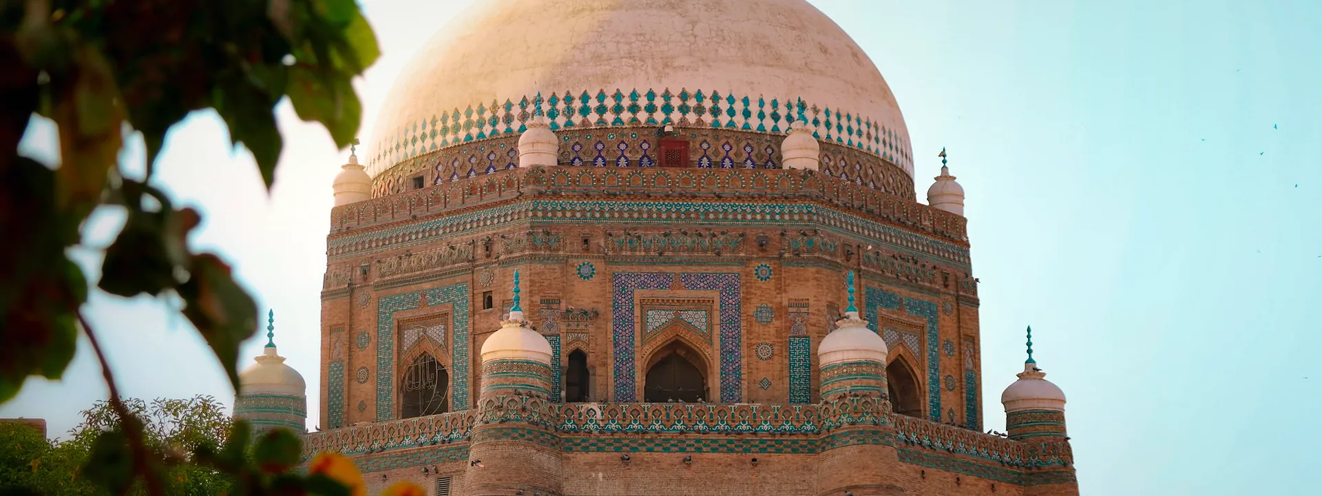 A historic shrine in Multan with its tiled dome and brick walls