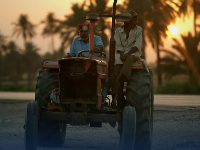 A tractor on a rural road at sunset near Nawabshah