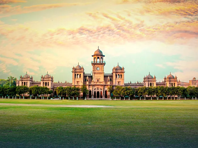 Islamia College Peshawar's domed facade against a vivid sunset sky