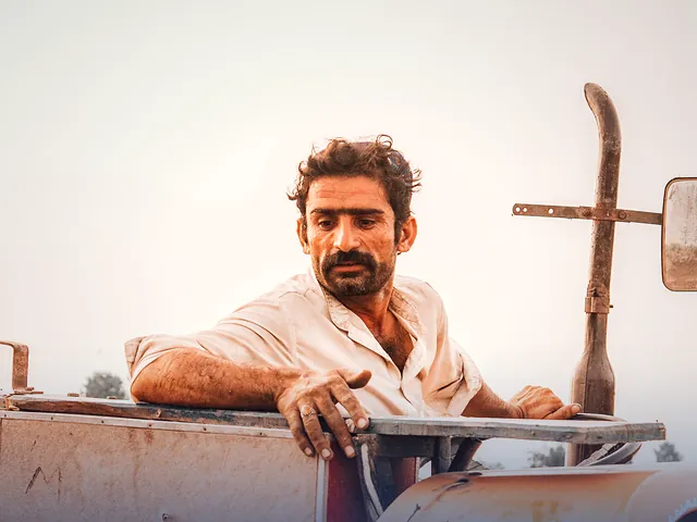 Farmer on a tractor in Sadiqabad