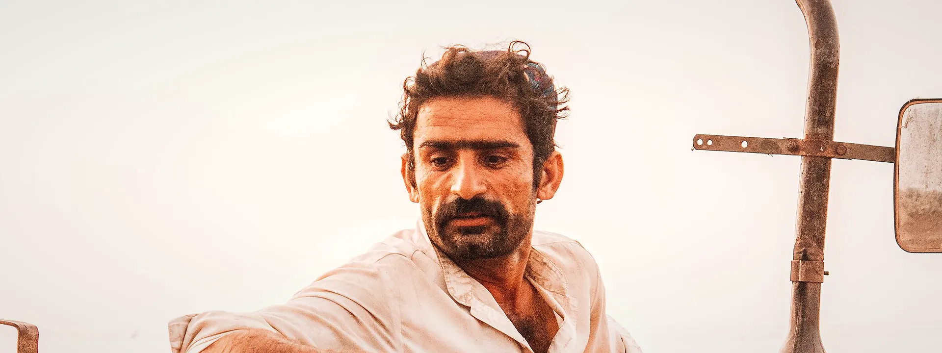 Farmer on a tractor in Sadiqabad