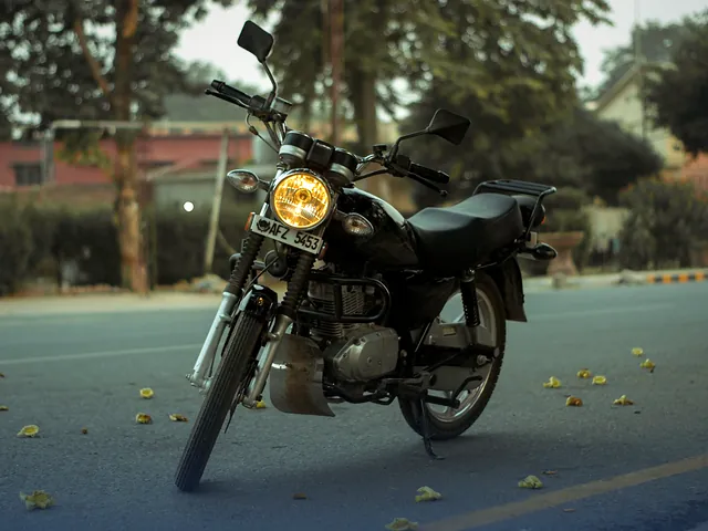 A motorcycle parked on a city street in Sargodha