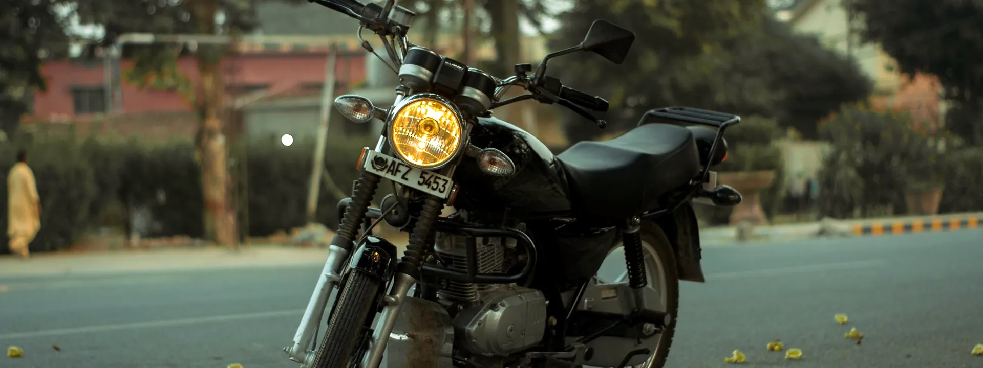A motorcycle parked on a city street in Sargodha