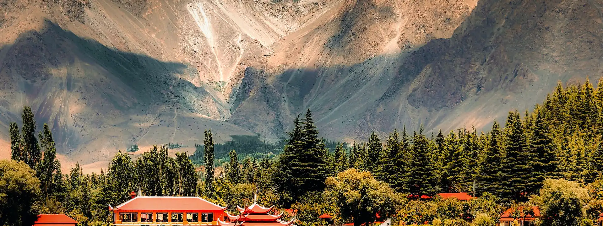 A calm lake beneath the mountains of Skardu