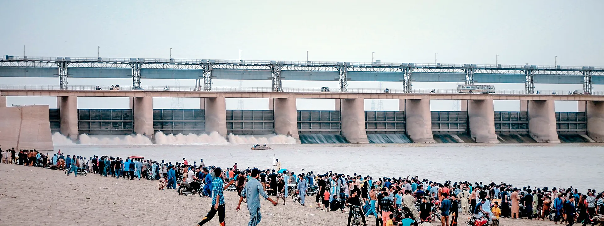 People gathered near Sukkur Barrage beside the Indus River
