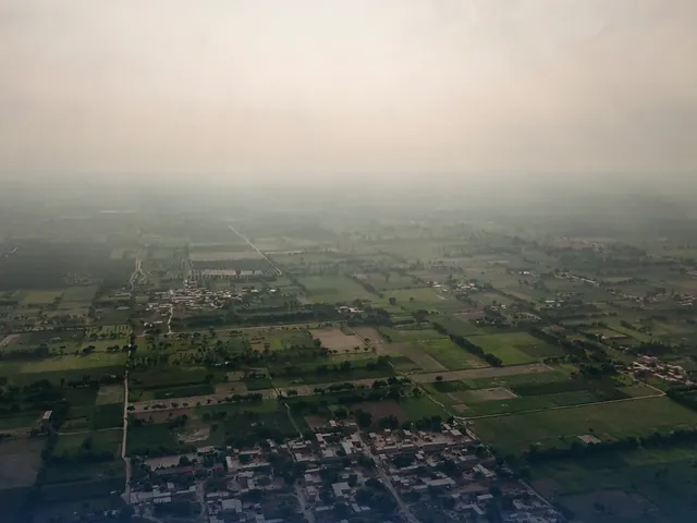 Aerial view of a village surrounded by fields in rural Punjab