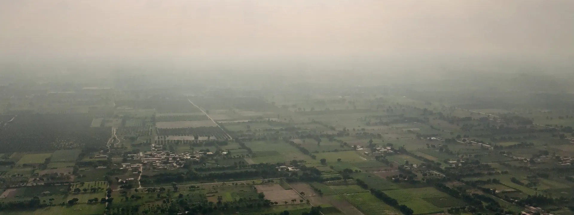 Aerial view of a village surrounded by fields in rural Punjab